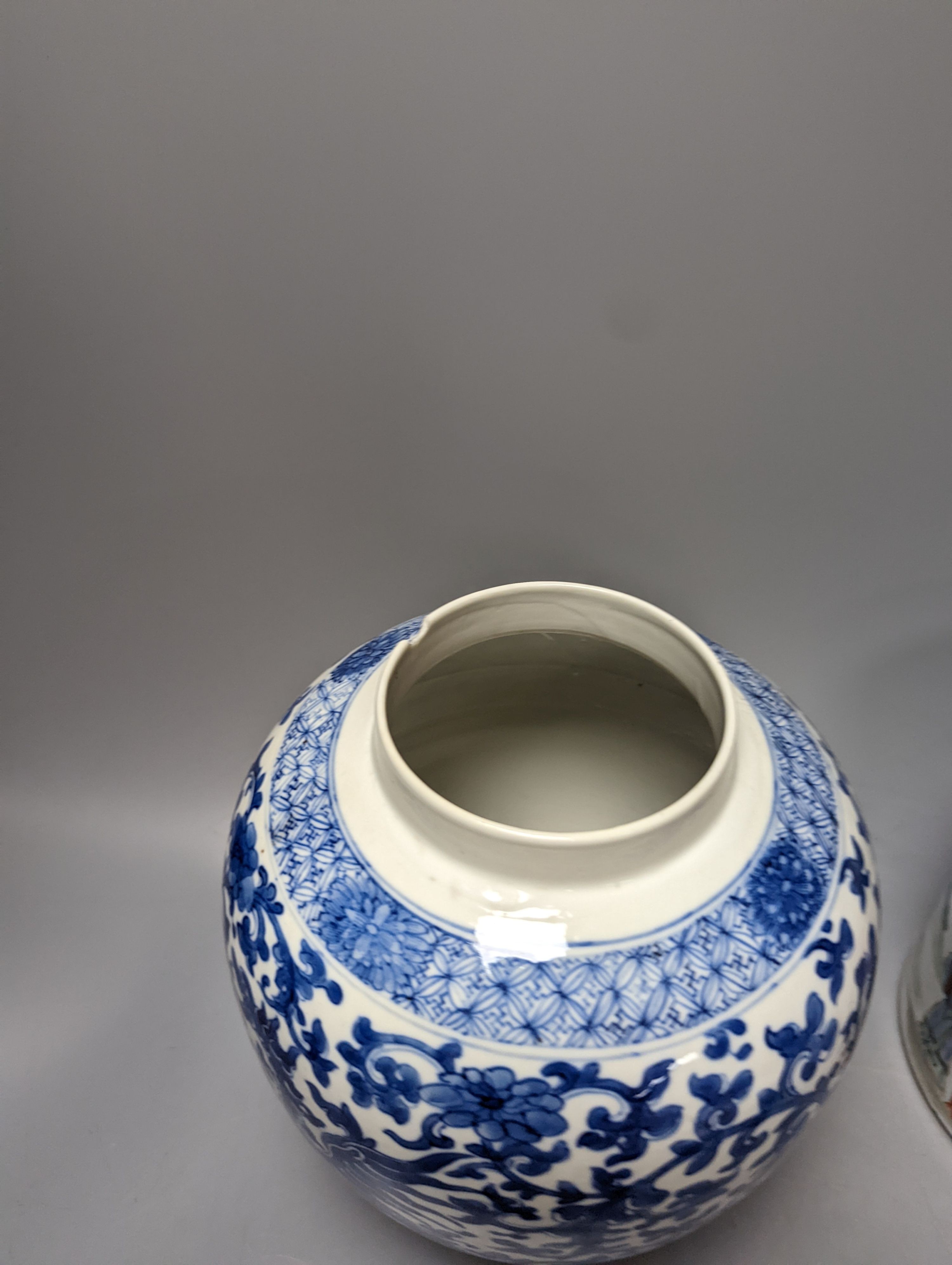 An Imari Japanese dish, a blue and white phoenix jar, and a famille verte brush pot with officials. Largest 29cm diameter